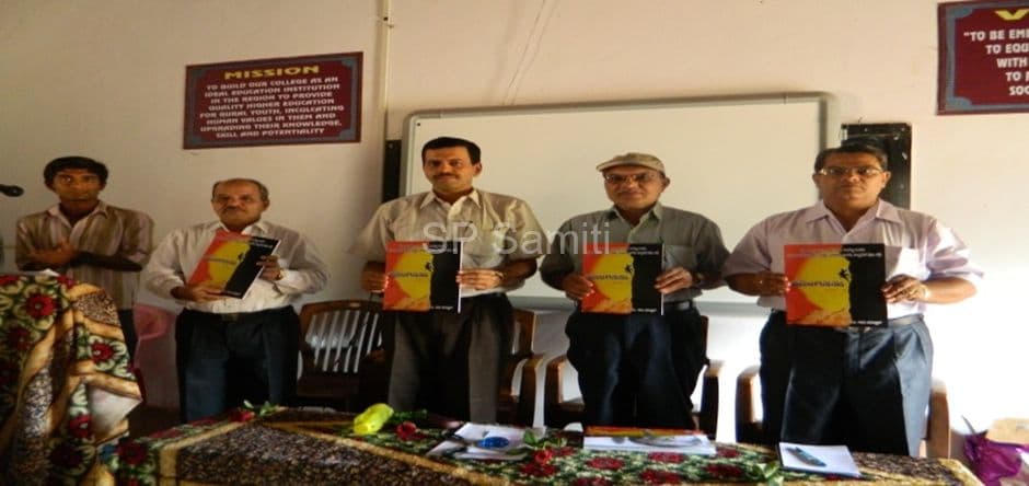 Guests releasing a book at a Kannada department programme