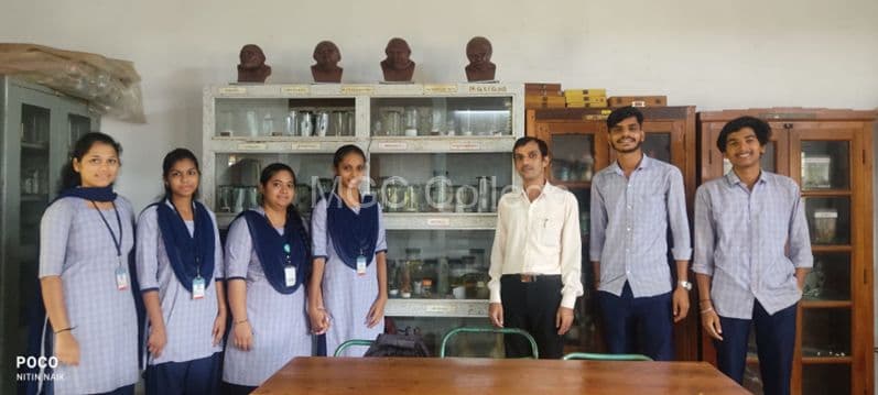Students and faculty in the zoology laboratory with museum specimens