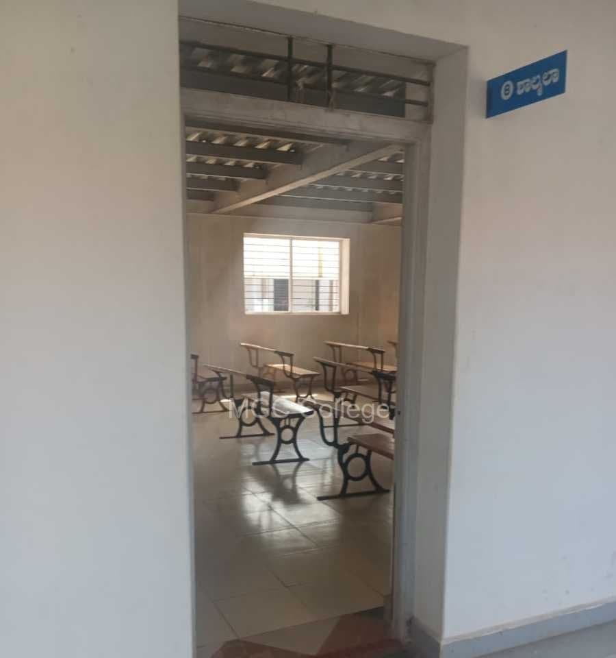 Classroom with benches seen from the corridor