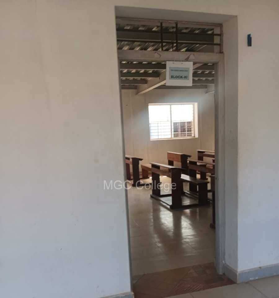 Classroom with wooden desks and benches