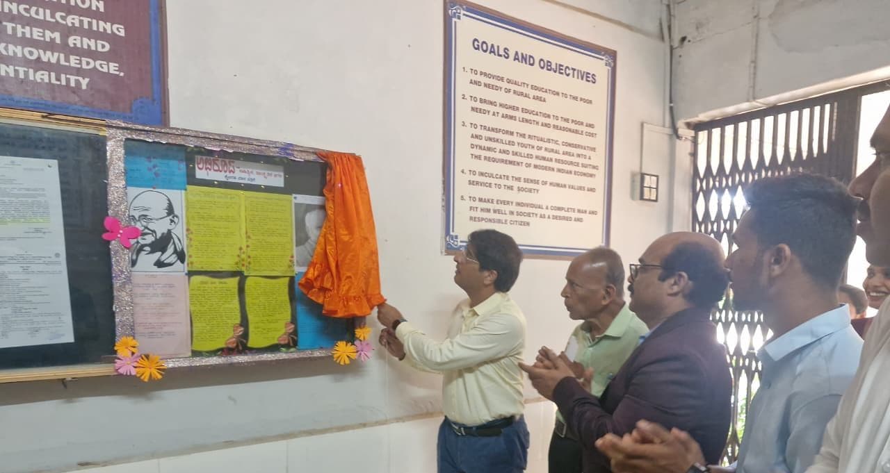 Dr. Shashibhushan Hegde unveiling the Abhiroopa handwritten magazine wall, 2025